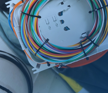 Colorful cables tied in a box
